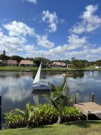 a view of a lake with houses in the back