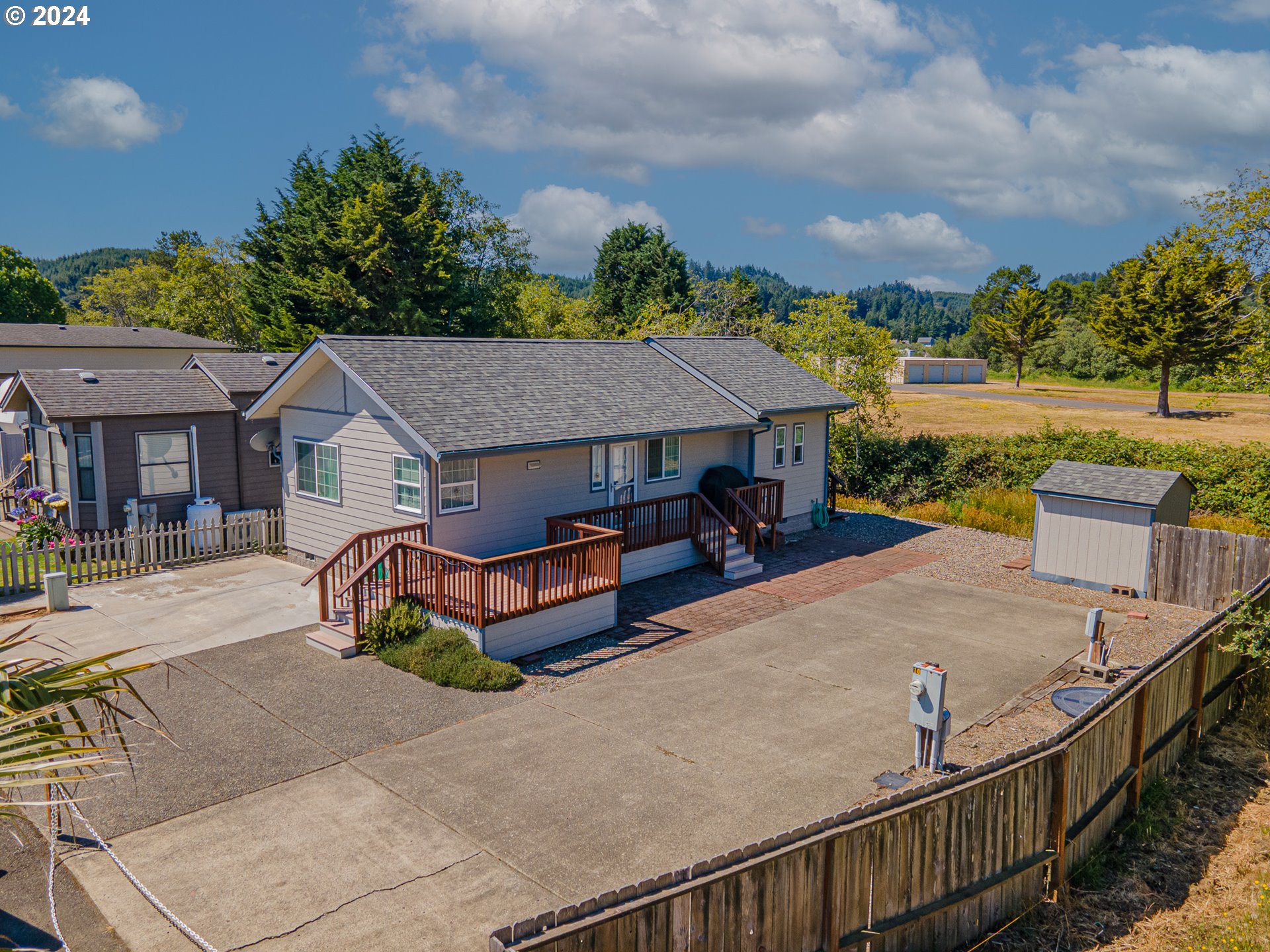 a aerial view of a house with table and chairs