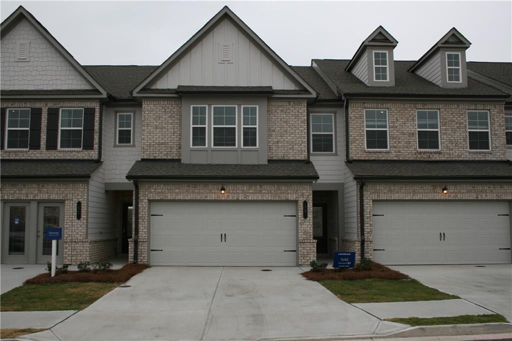 a front view of a house with a garage