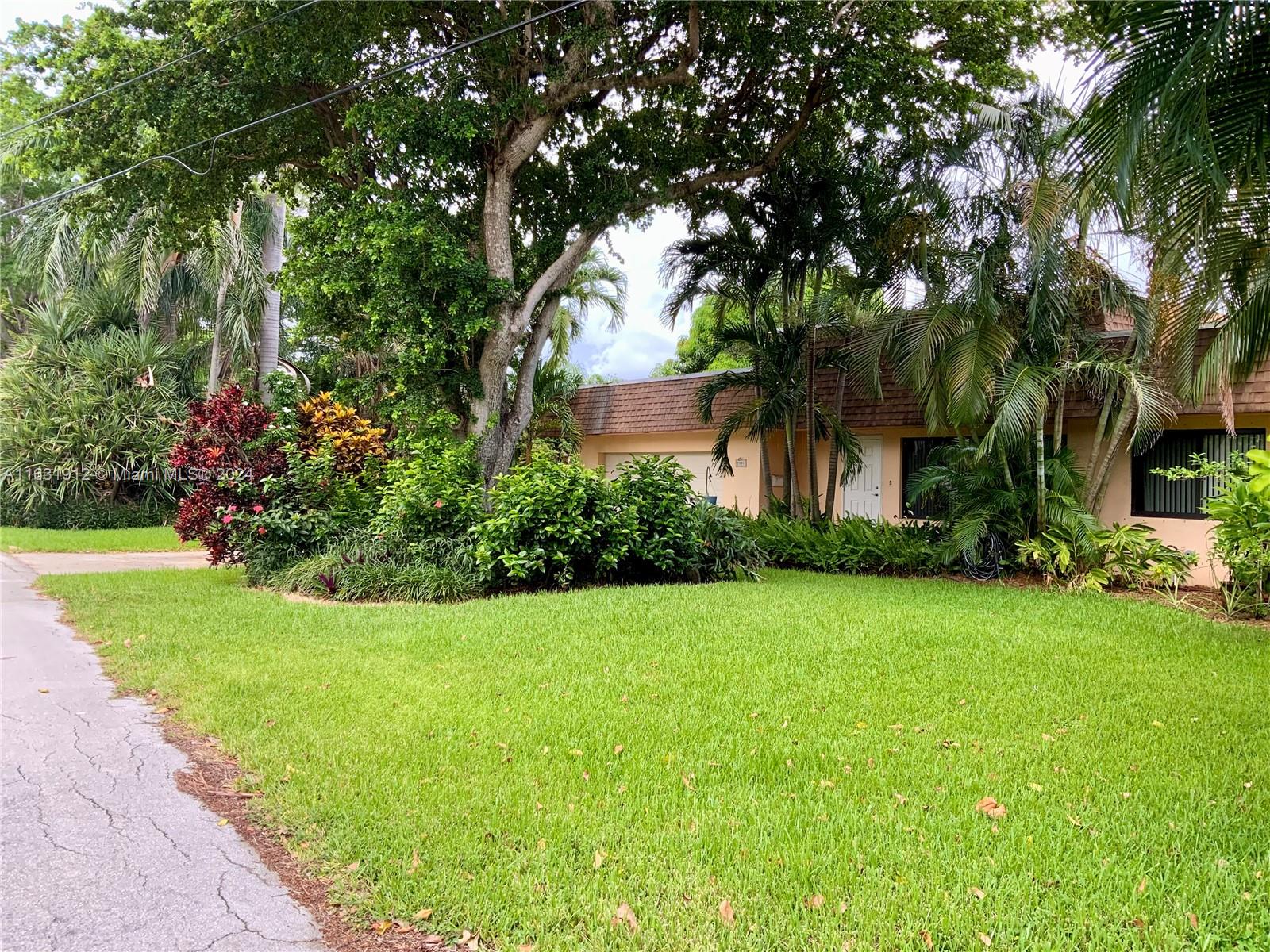 a view of a house with a garden