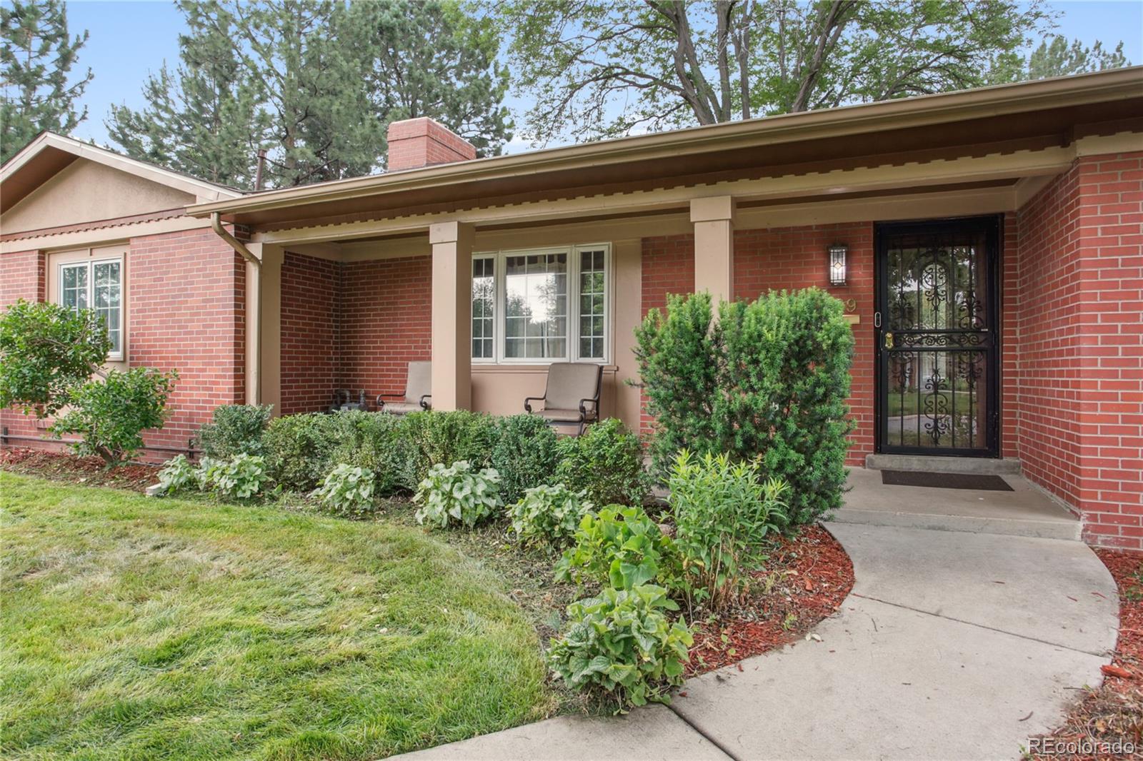 front view of the house with potted plants