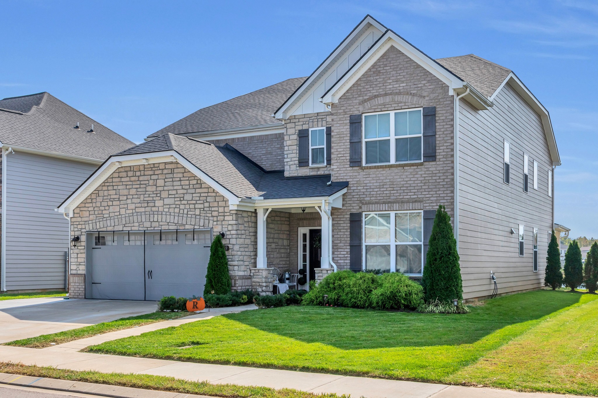 Welcome Home! No expense was spared on this one! Pavers walkway to the front porch! Tile Front Porch! Beautiful landscaping! 3rd Drive way for additional Parking!