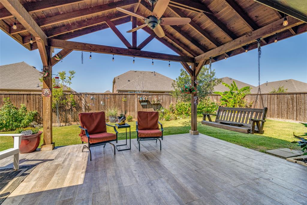 a view of a chairs and table in the patio