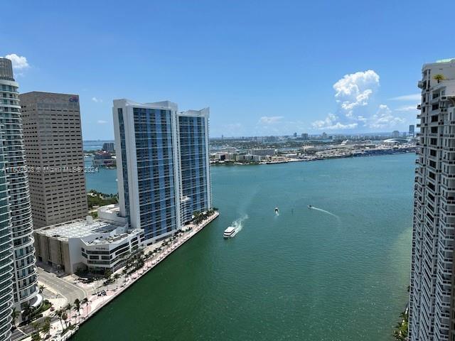 a view of a lake with tall buildings