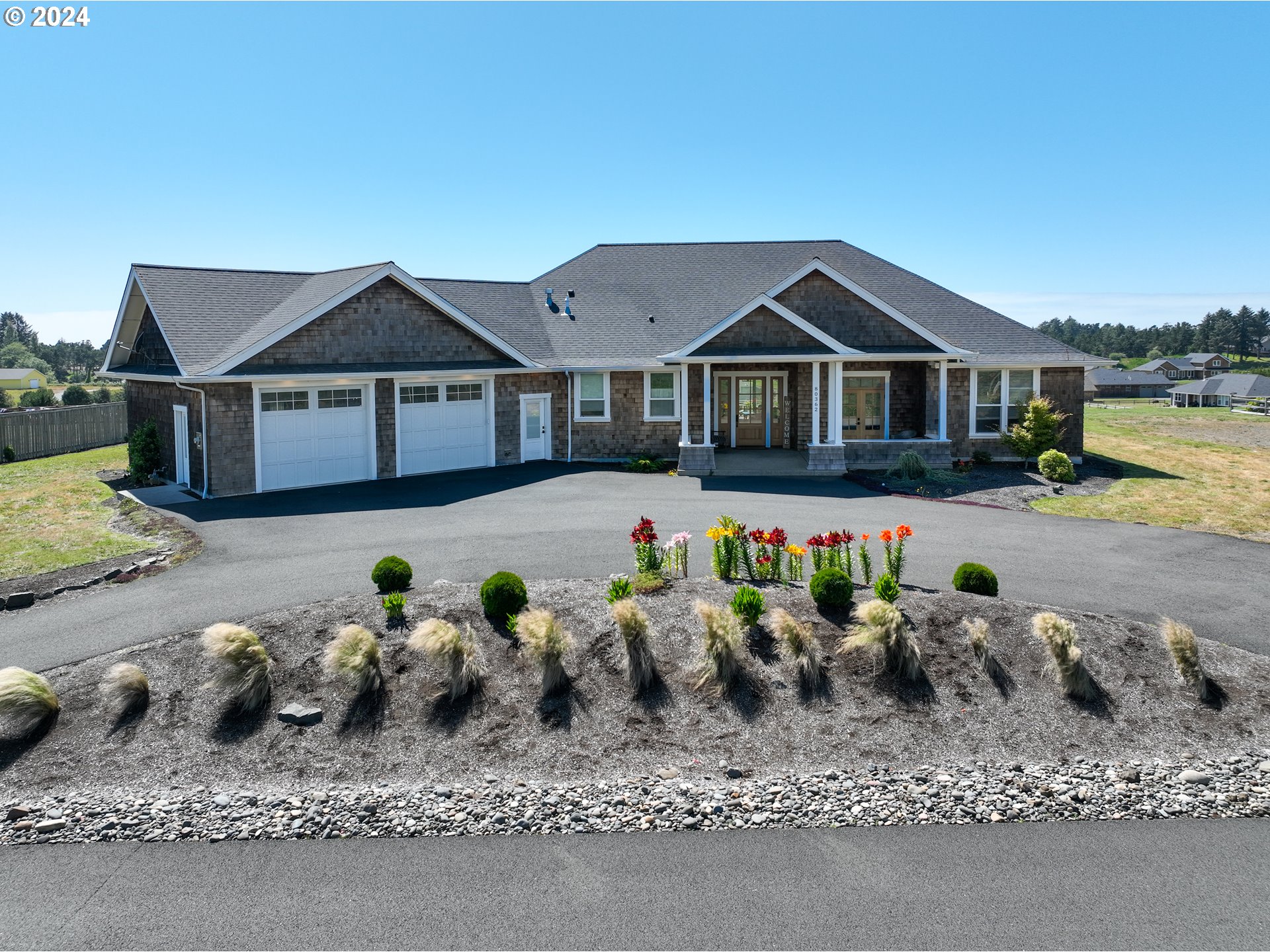 a front view of a house with garden