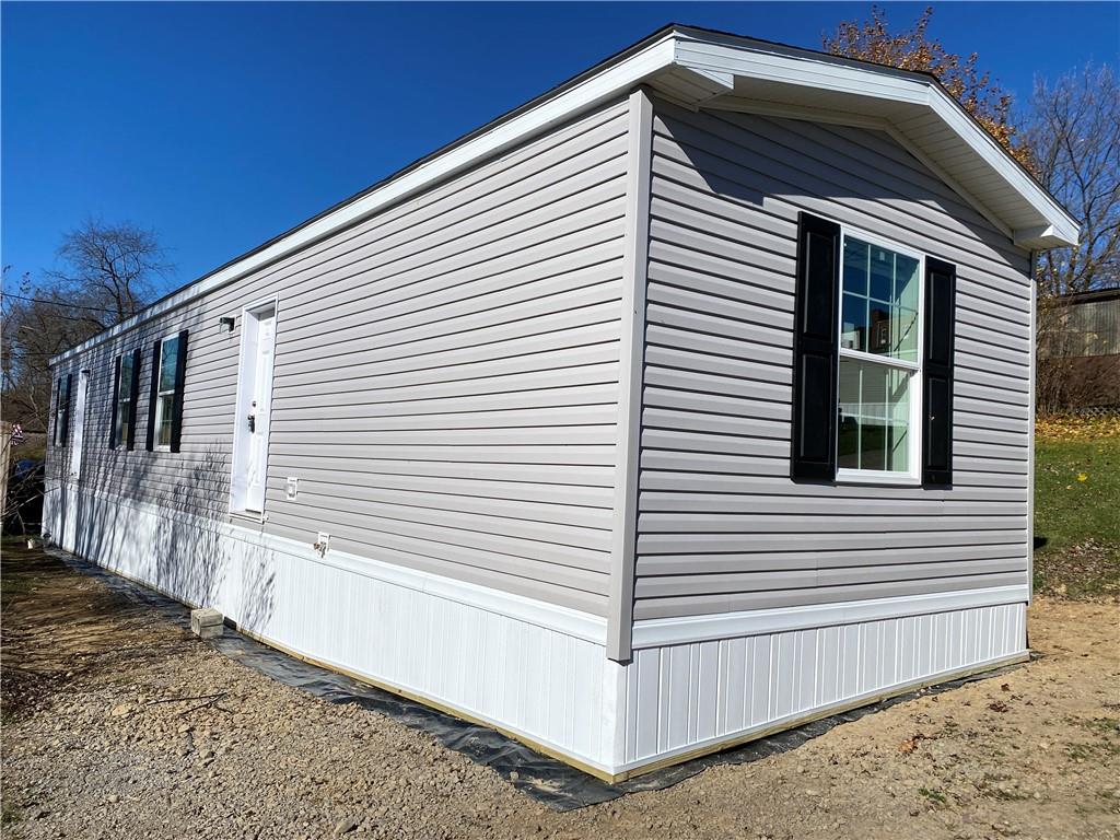 a view of a house with a yard and garage