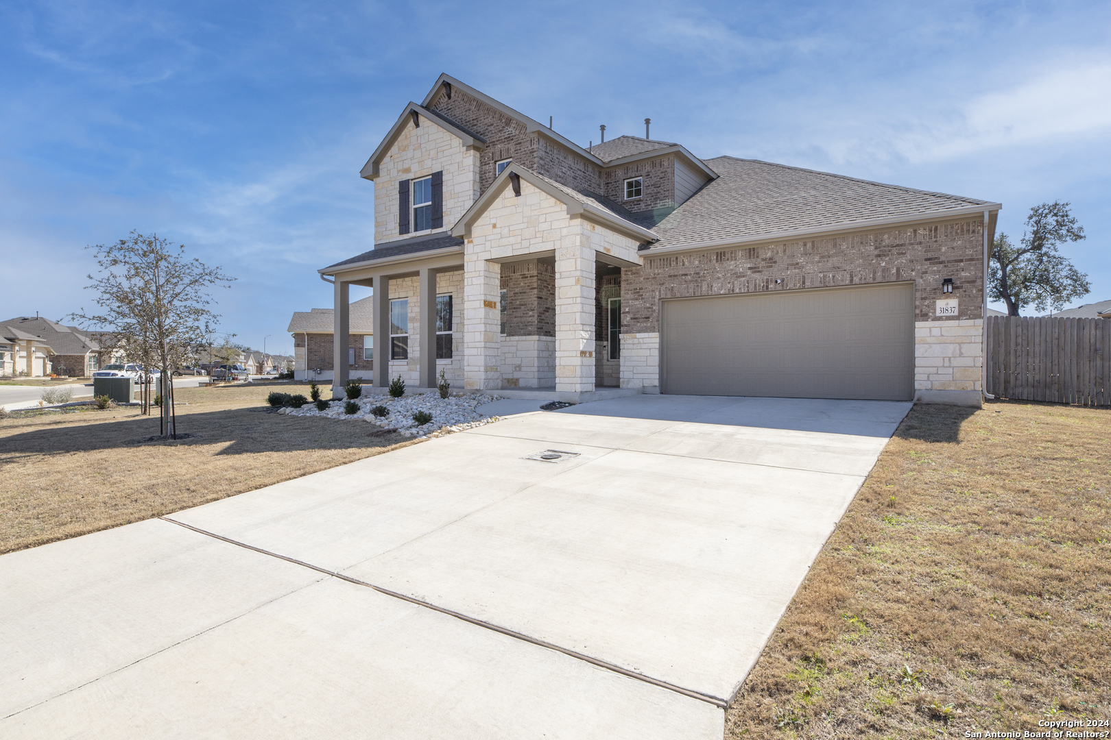 a front view of a house with a yard