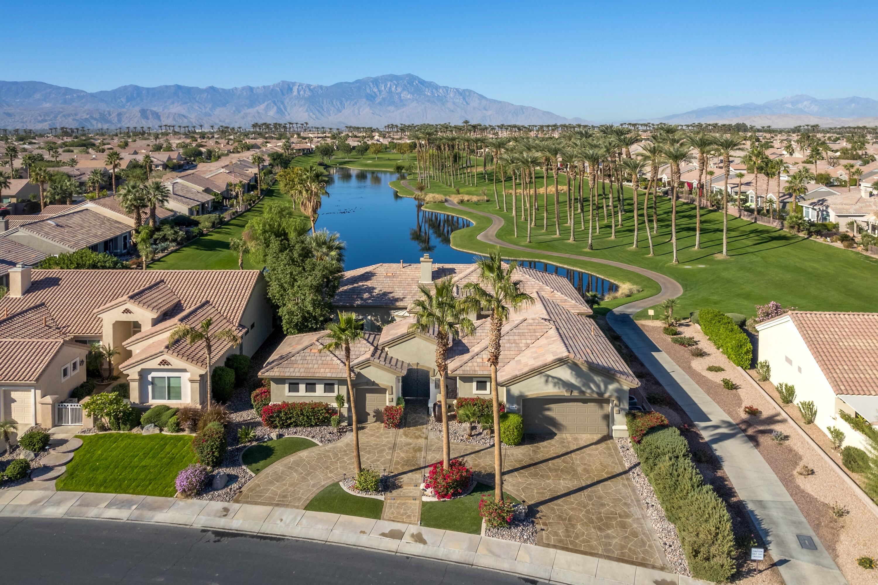 an aerial view of a house with a lake view