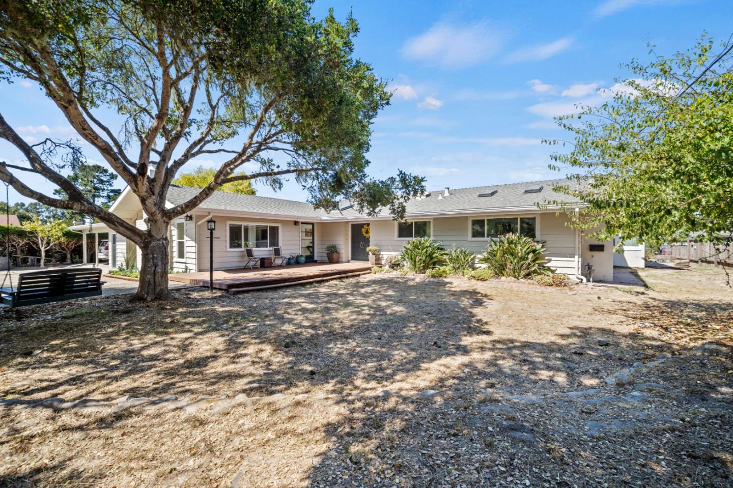 a front view of a house with a garden