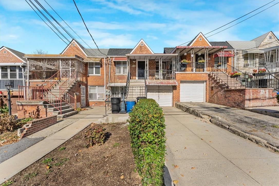 View of front of property featuring a garage