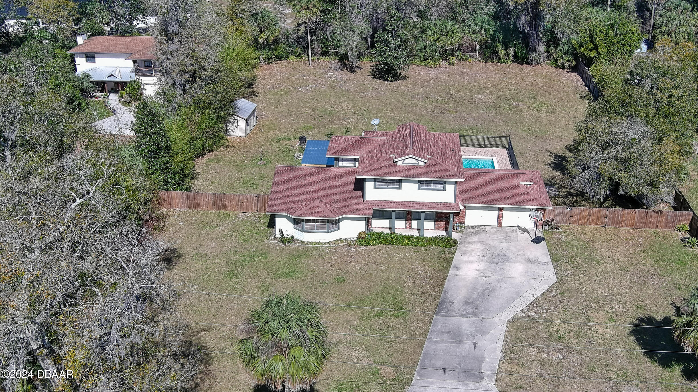 an aerial view of a house with outdoor space