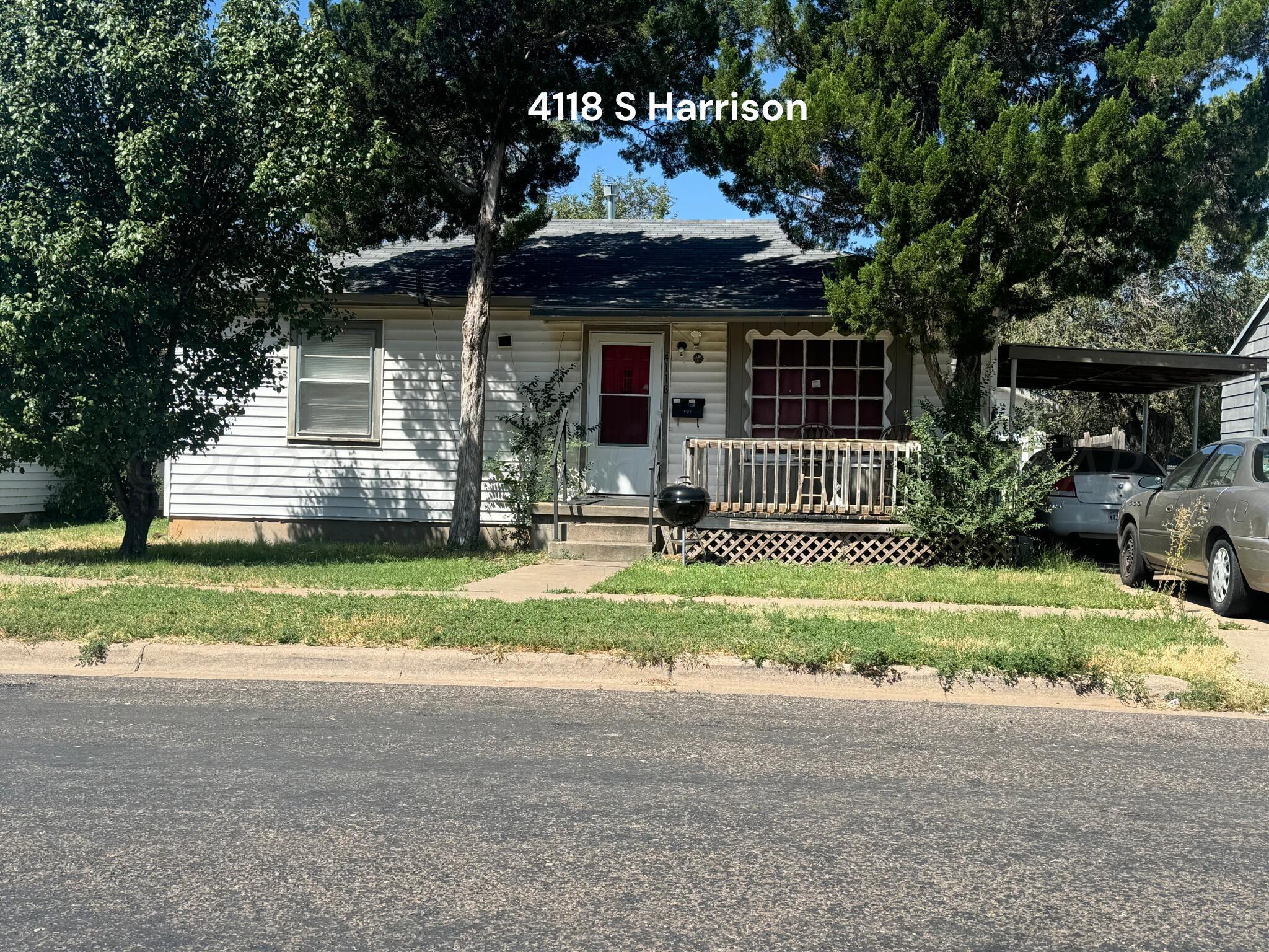 a front view of a house with a yard table and chairs