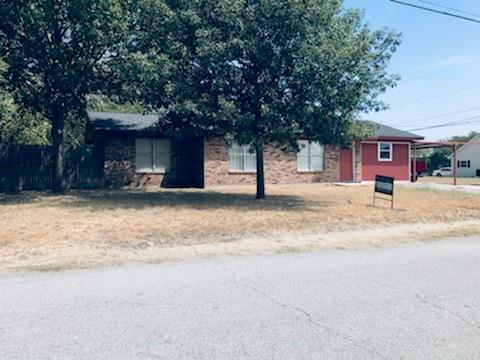 a house with a tree in front of it