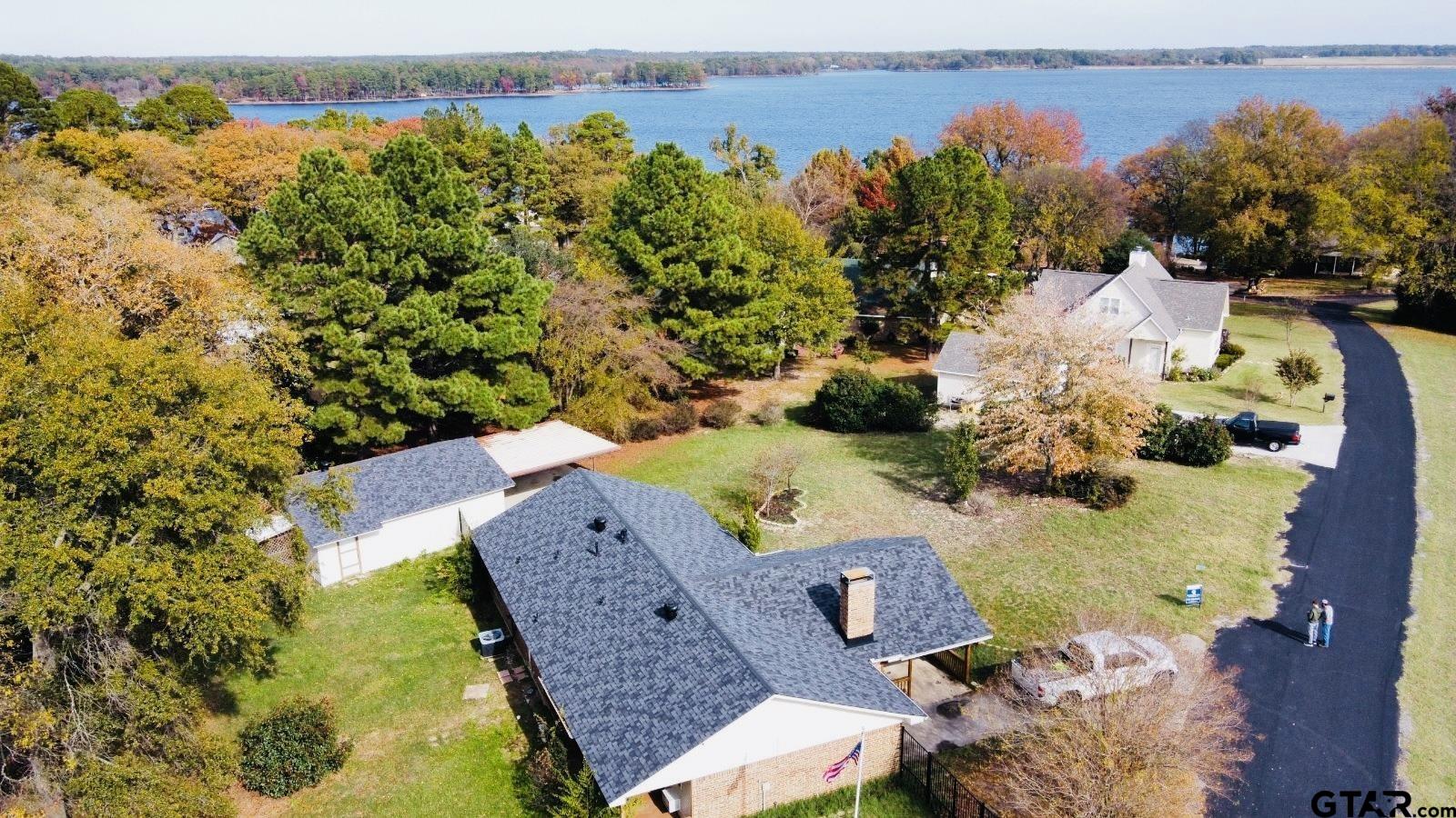 an aerial view of a house with a swimming pool