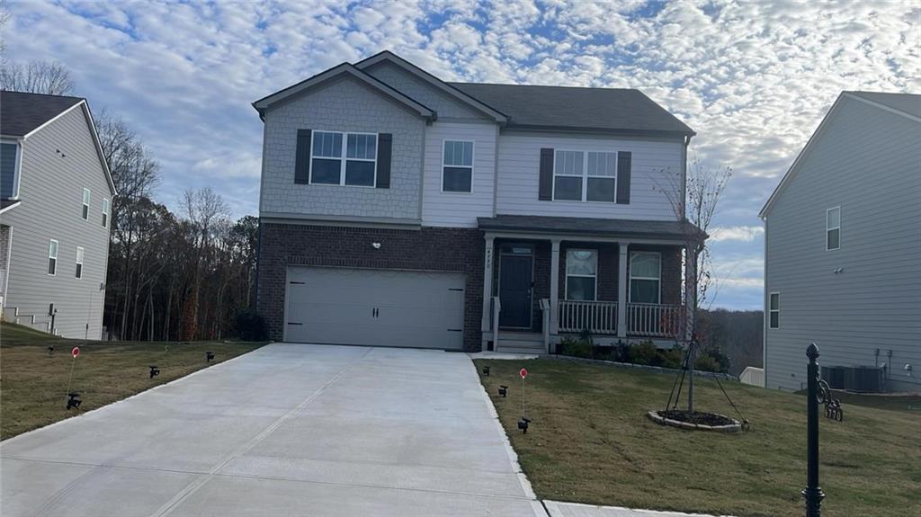 a front view of a house with garage