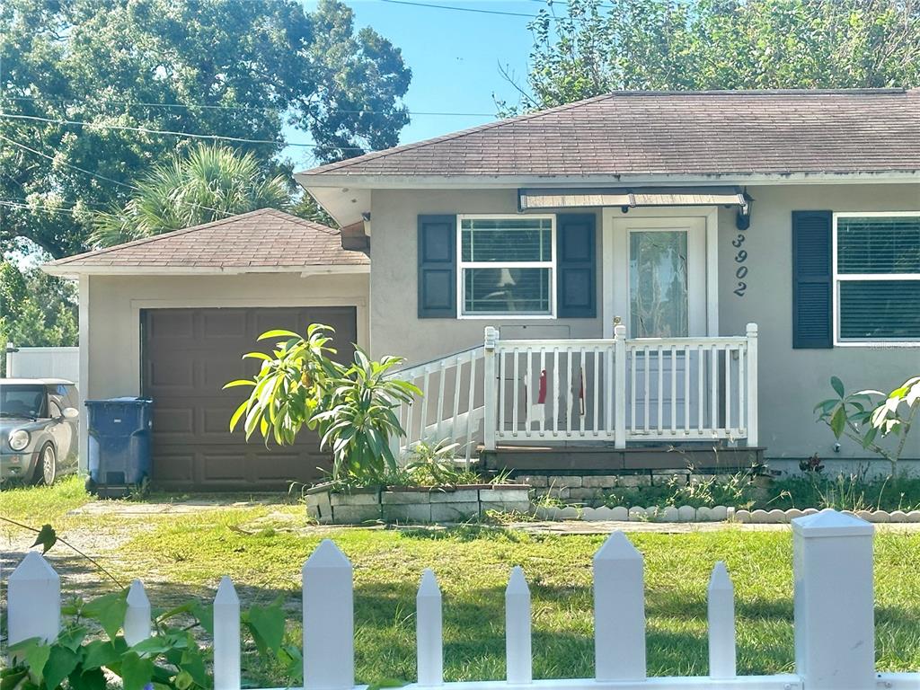 a view of a house with a small yard