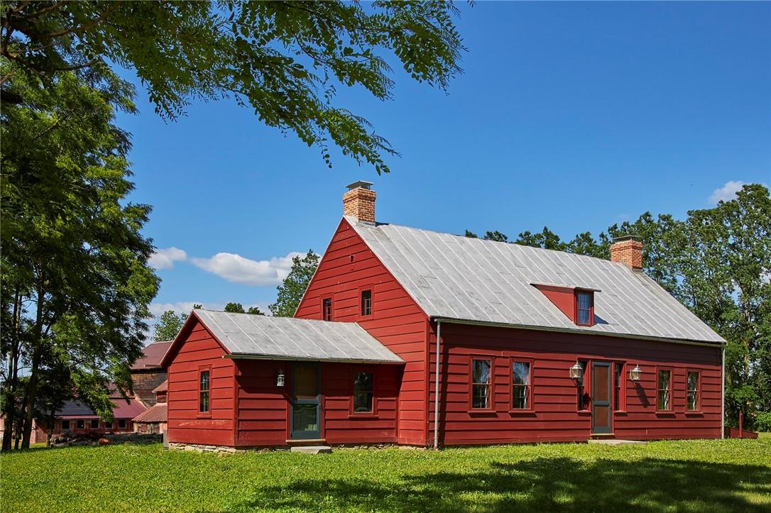 Rear view of house with a lawn