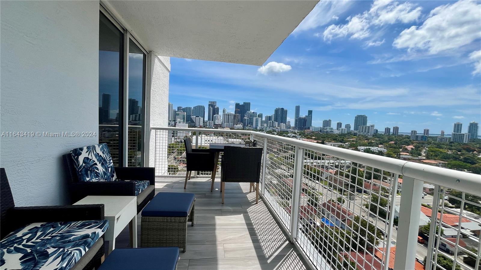 a view of balcony with furniture