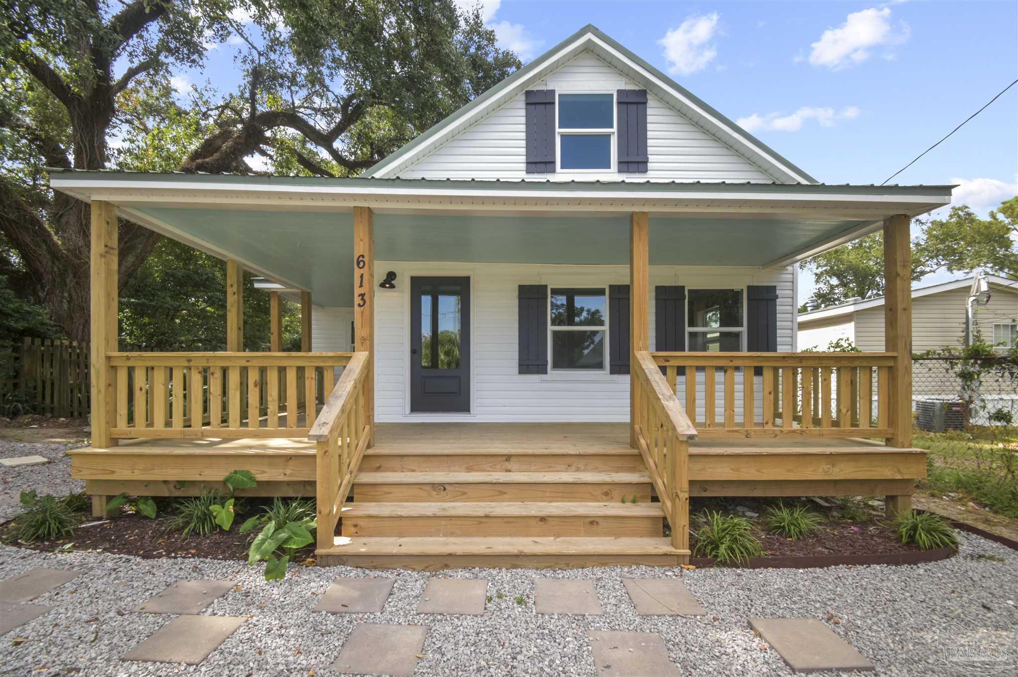 a front view of a house with a porch