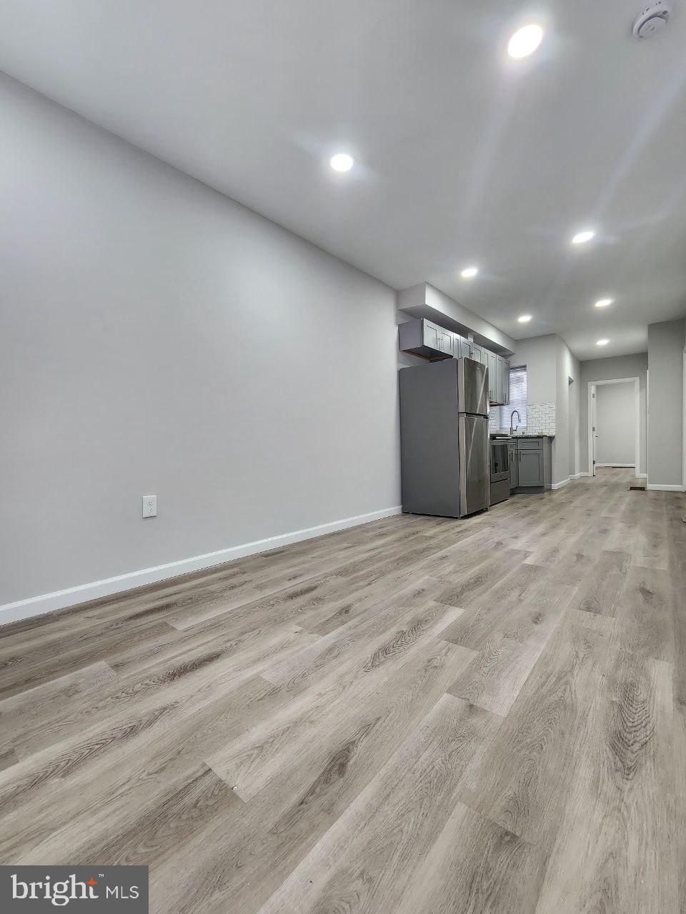 a view of a big room with wooden floor