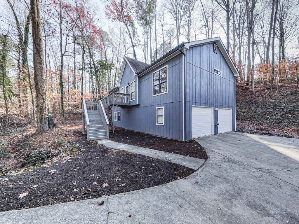 a view of a house with a yard covered in snow