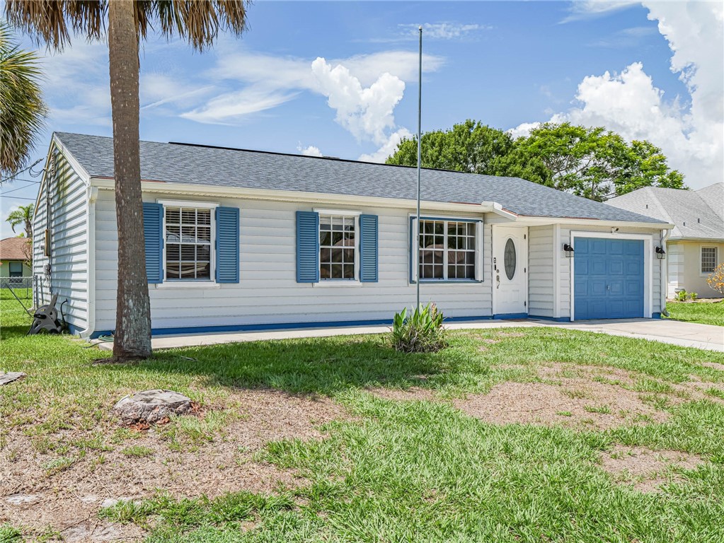 front view of a house with a yard