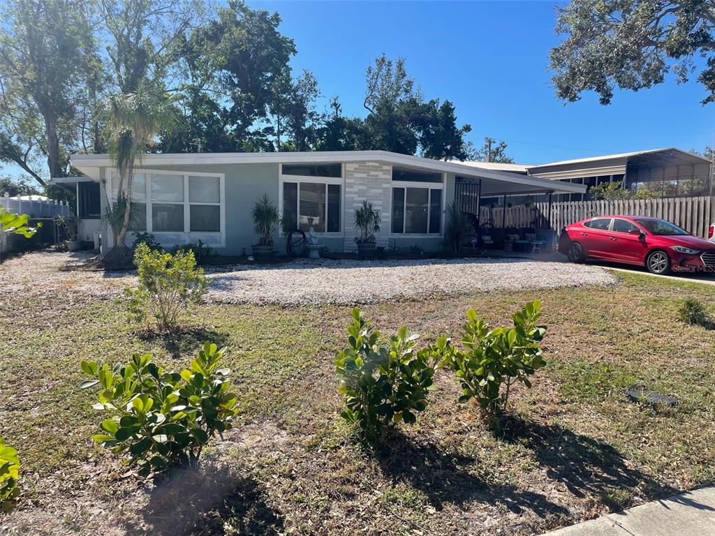 a front view of house with yard and seating area