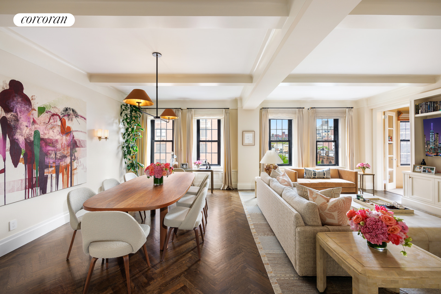 a living room with furniture and a chandelier