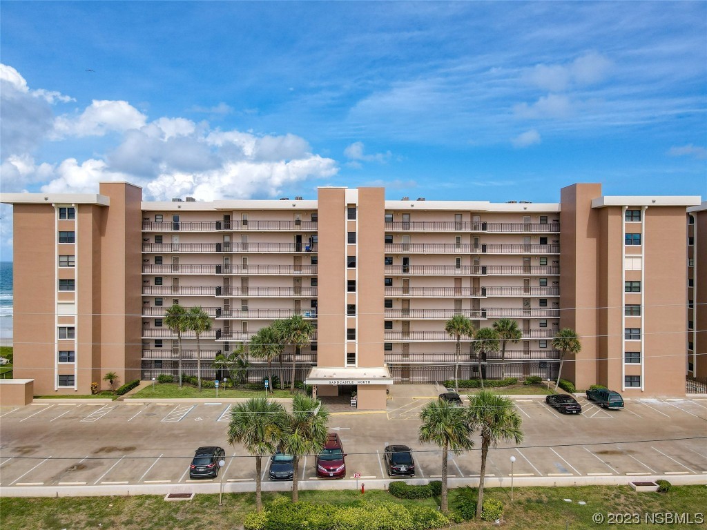 a front view of building with yard