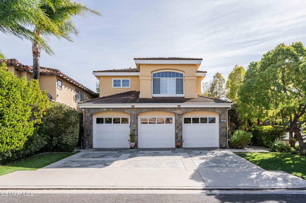 a front view of a house with a garage