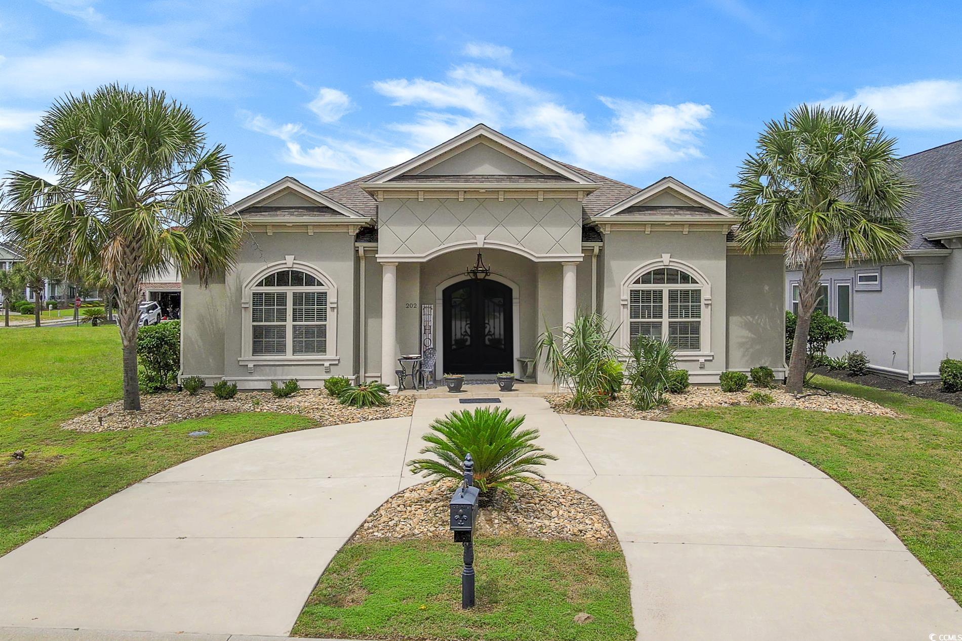 View of front facade with a front yard