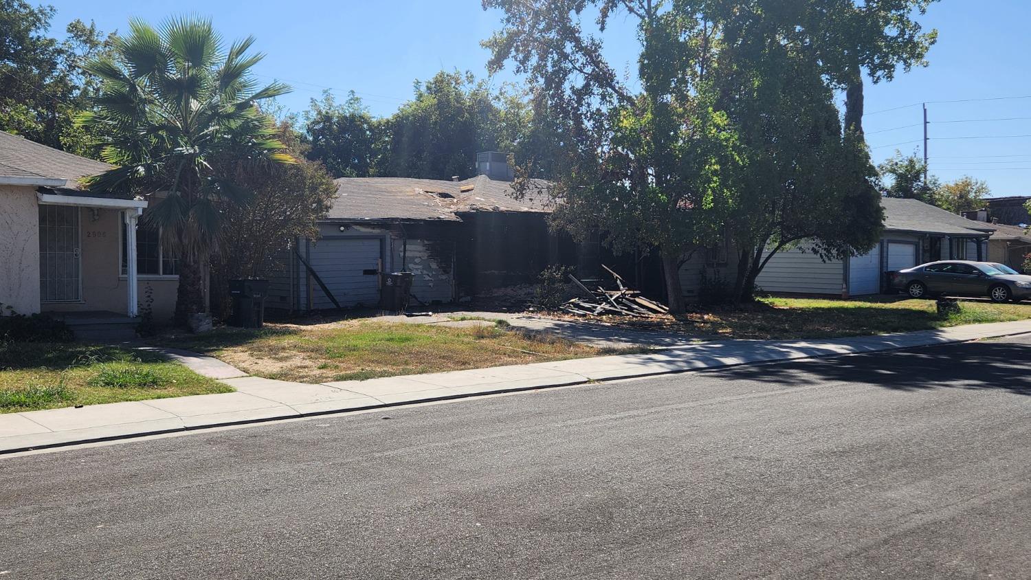 a view of a house with a yard and garage