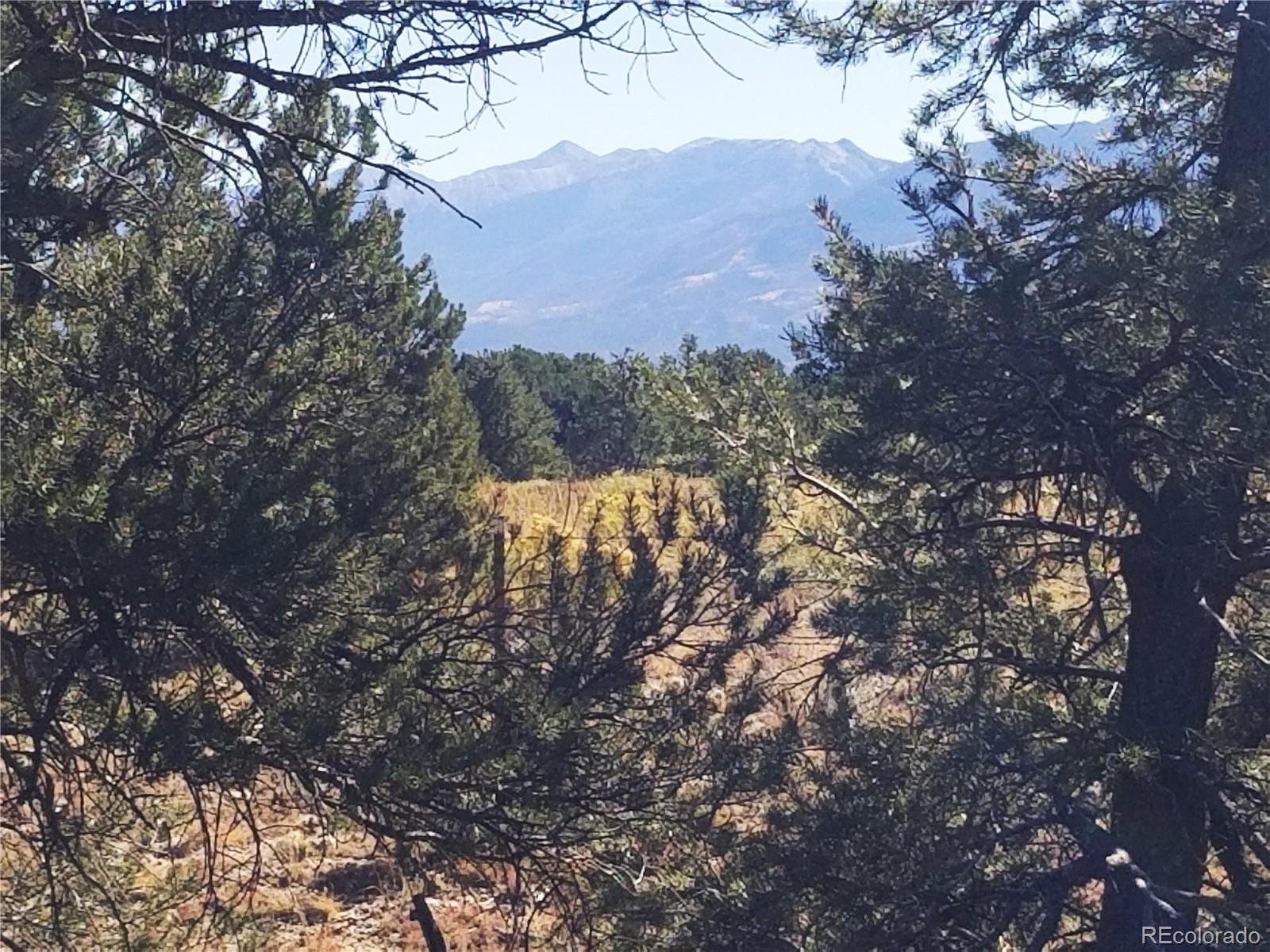 a view of mountain view with lots of trees