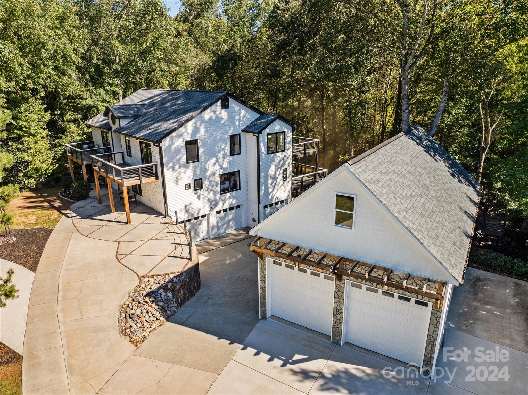 an aerial view of a house with roof deck