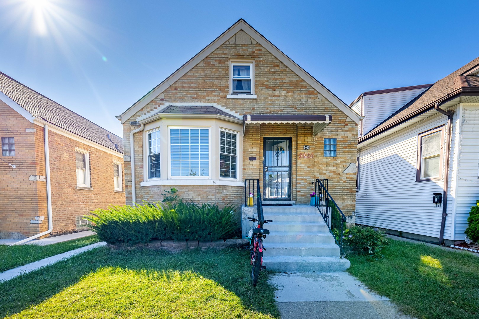 a front view of a house with a yard