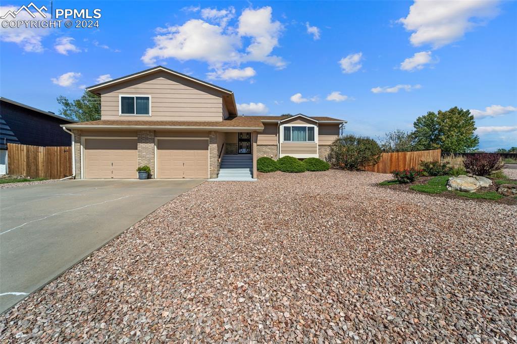 View of front of property featuring a garage