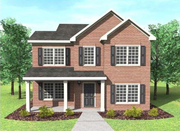 a front view of a house with a yard and potted plants