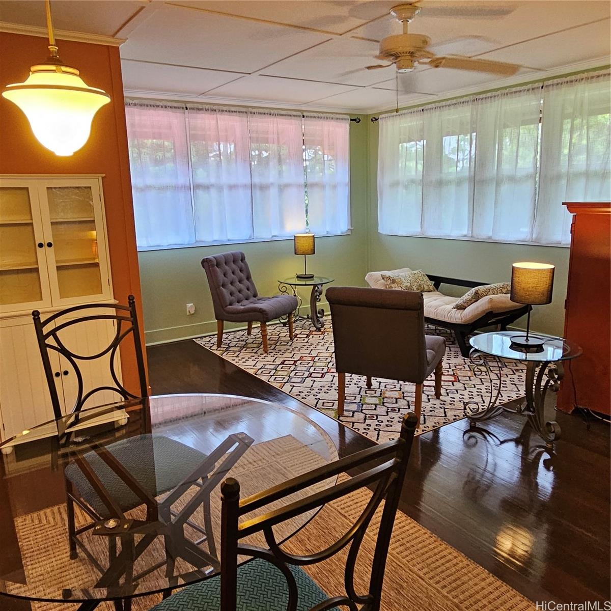 a view of a dining room with furniture and wooden floor