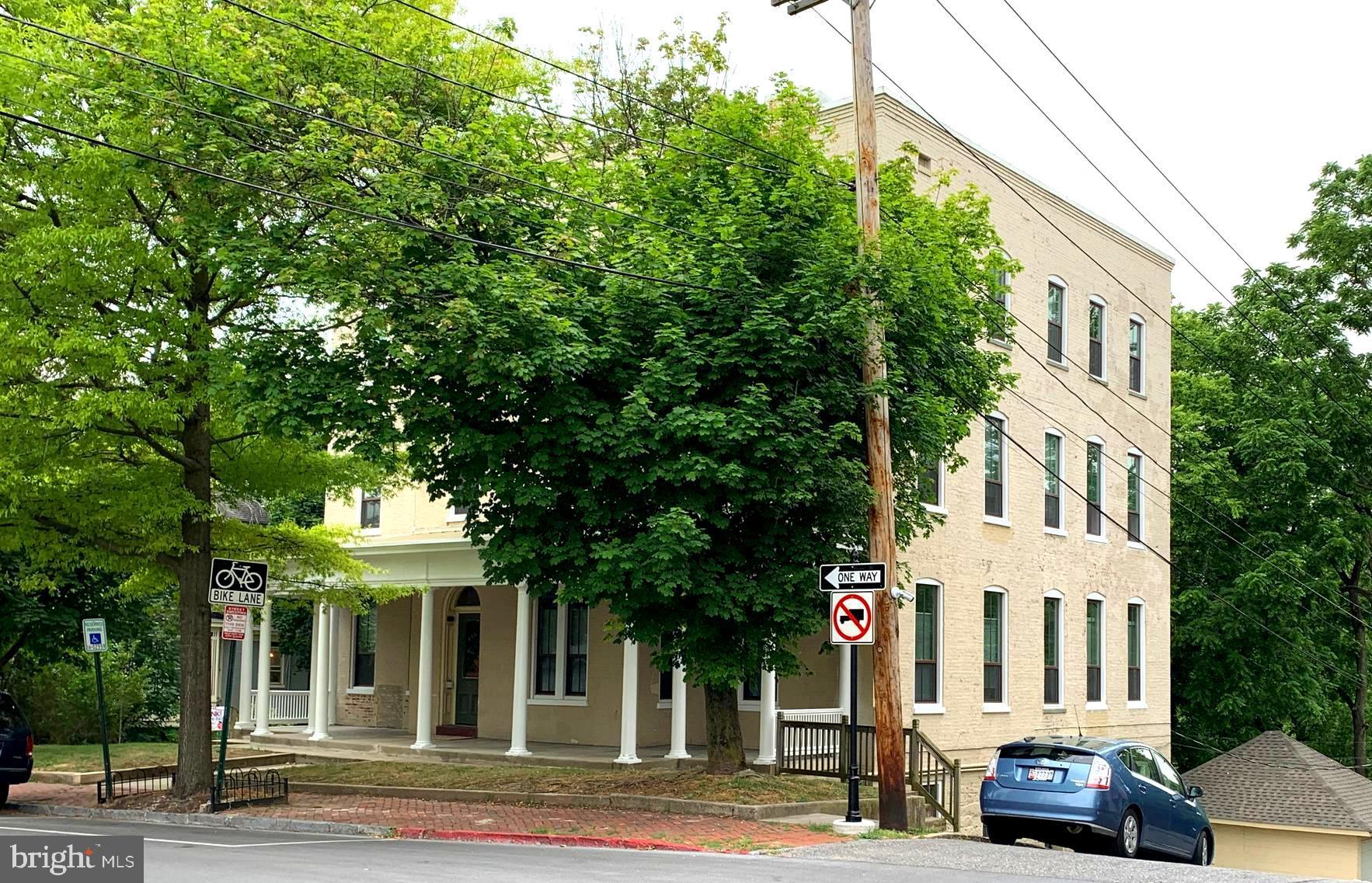 a view of a parked cars in front of house