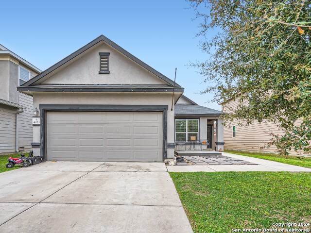 a front view of a house with yard