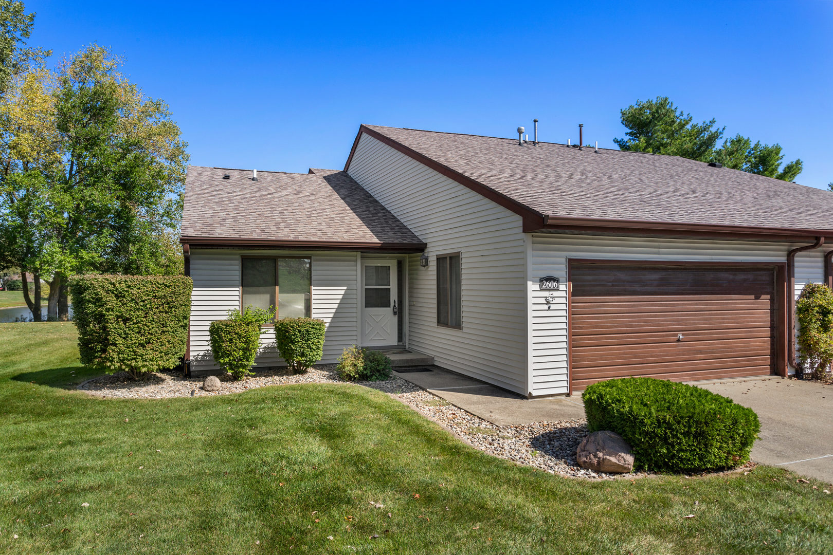 a front view of a house with a yard