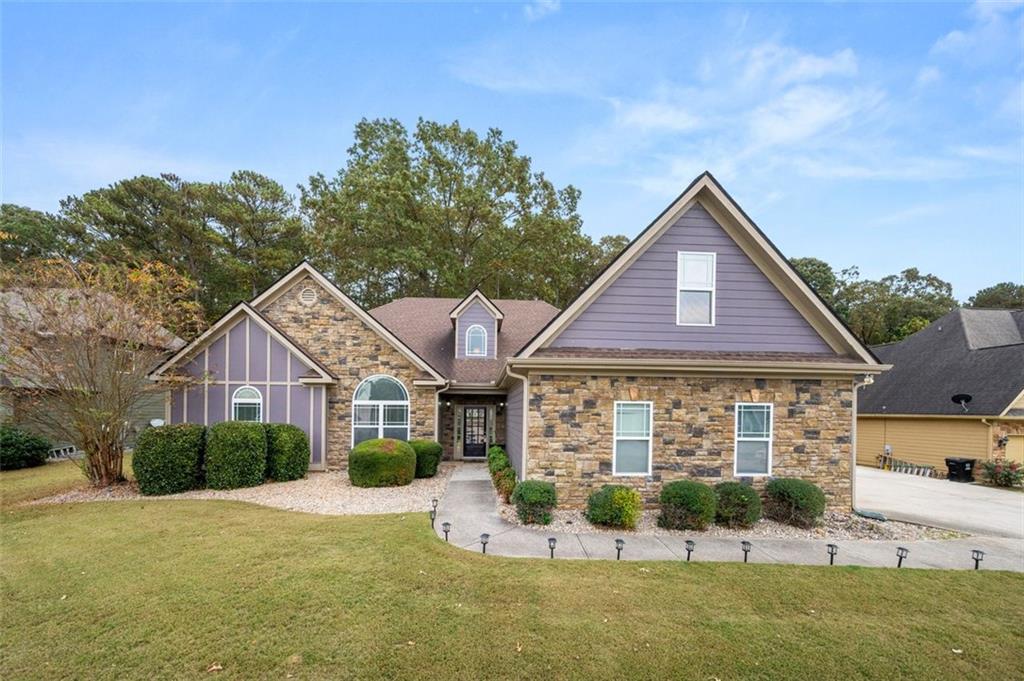 a front view of a house with a yard