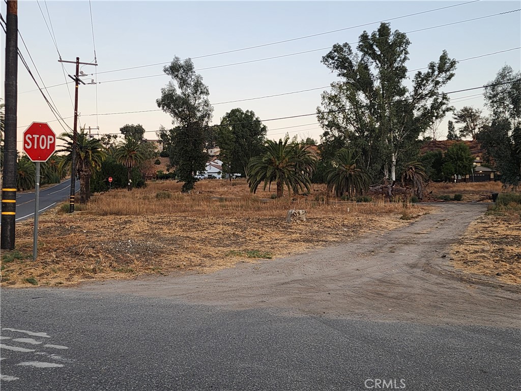 a view of a road with a building in the background