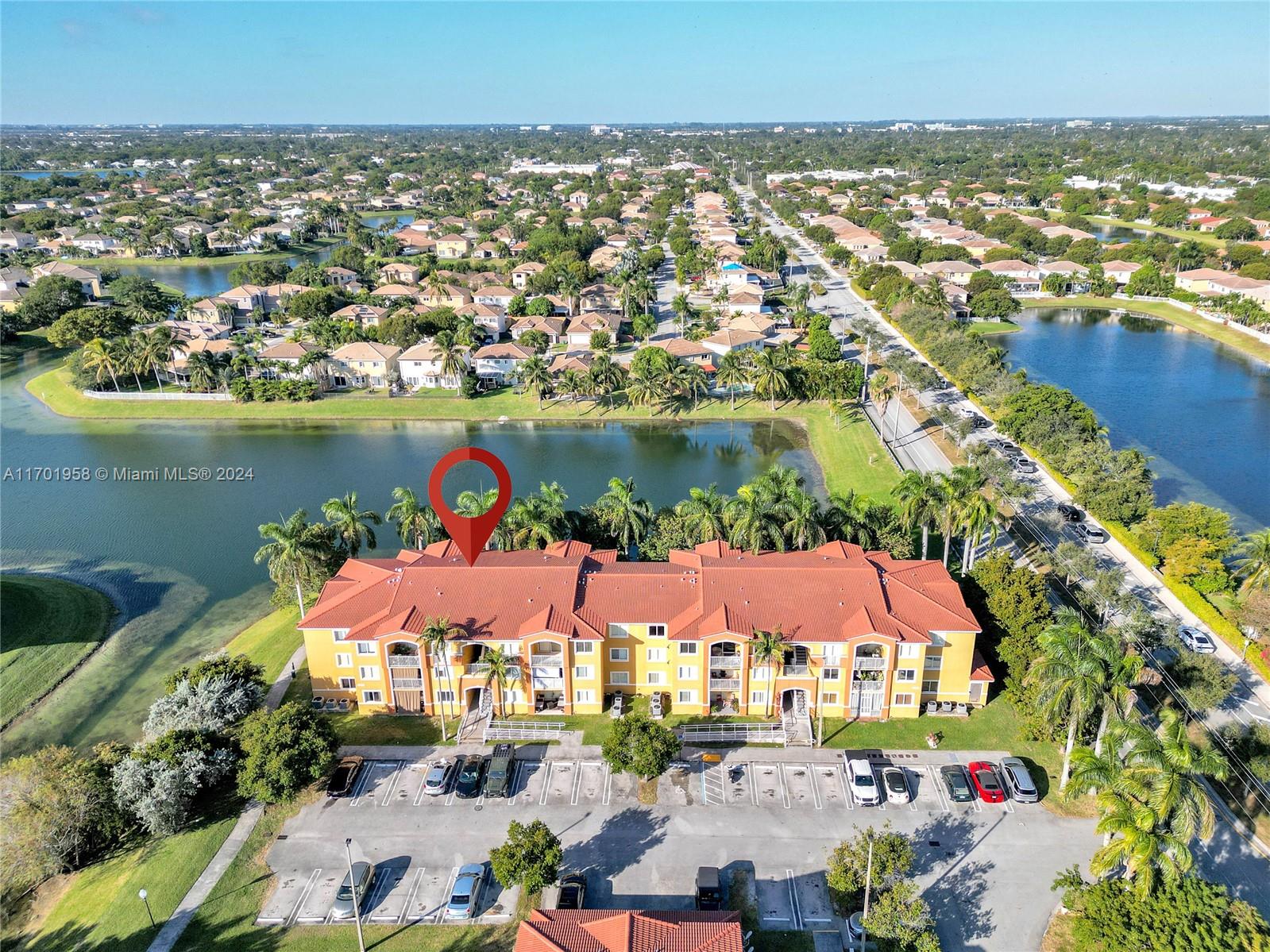 an aerial view of a house with a lake view