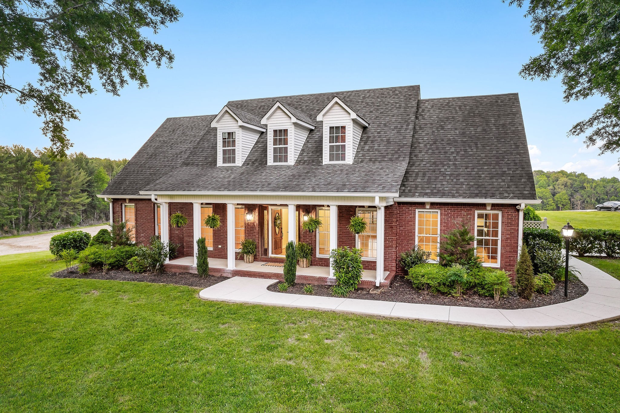 a front view of house with yard and green space