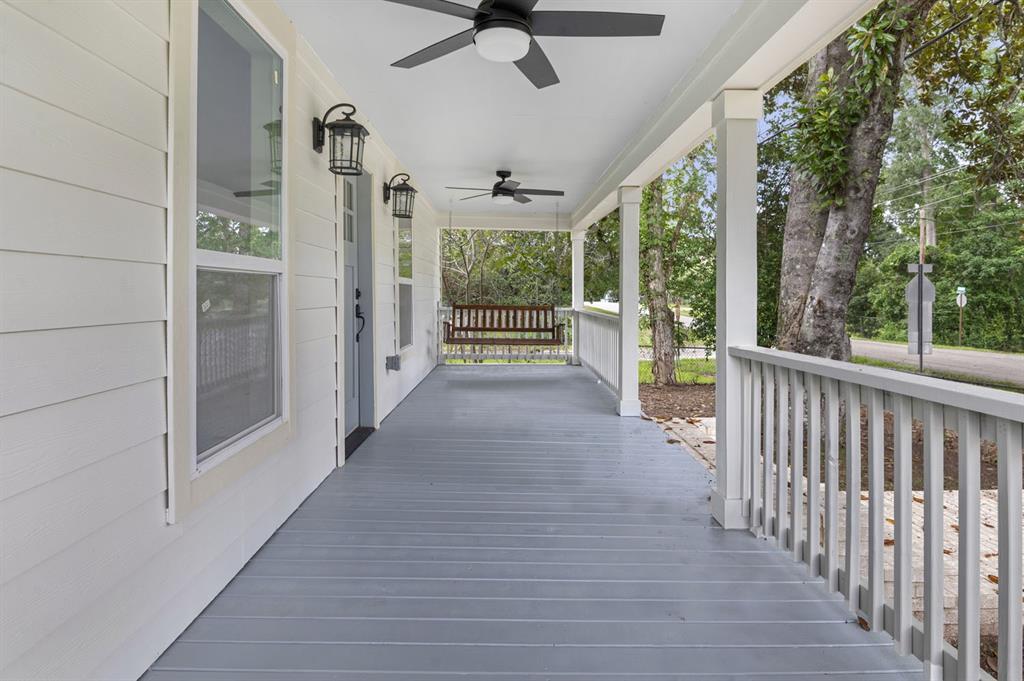 a view of a porch with wooden floor and outdoor space