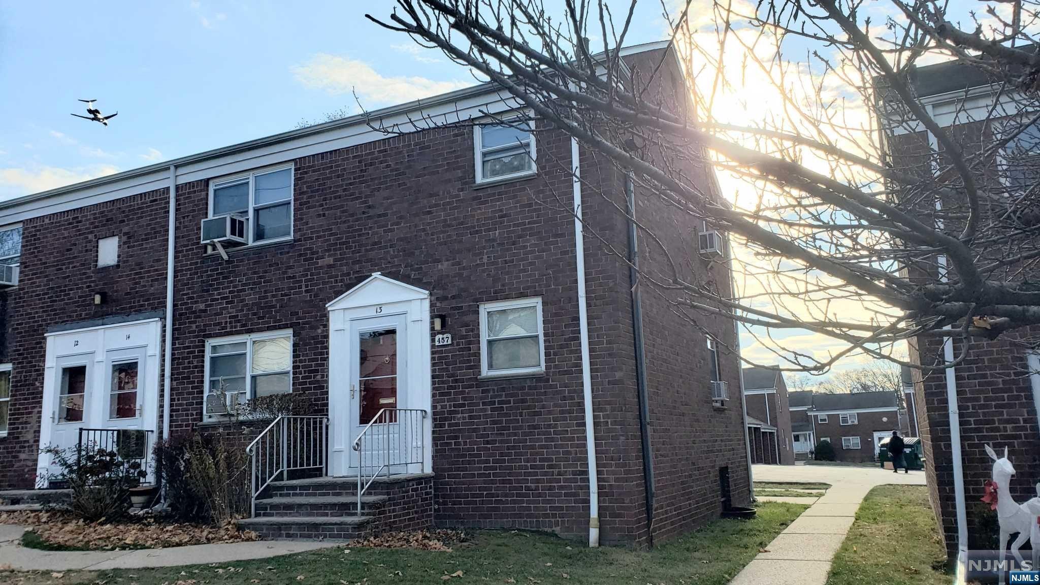 a front view of a house with yard