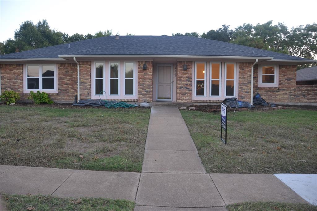 front view of a house with a yard