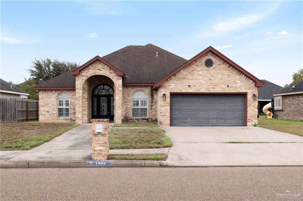 View of front of property with a garage