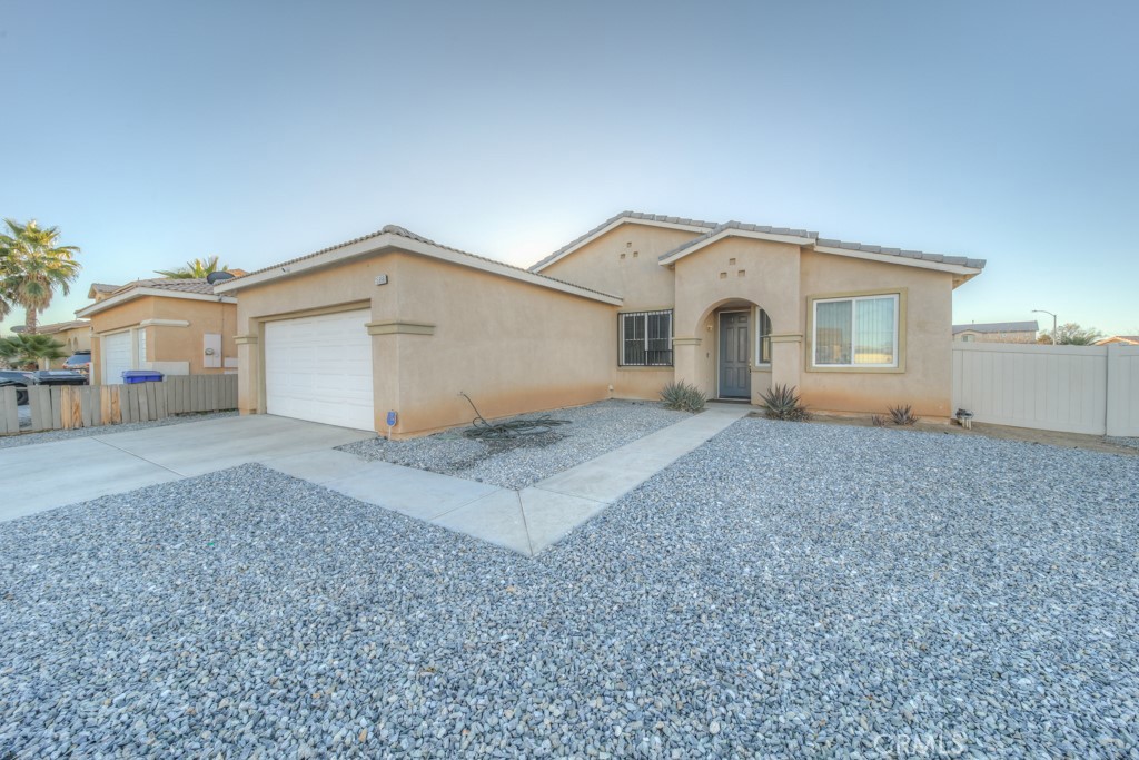 a view of a house with a yard and garage